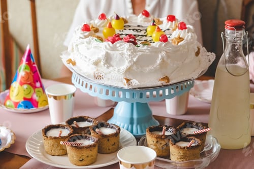 Preview: Festive Birthday Cake and Treats on Table