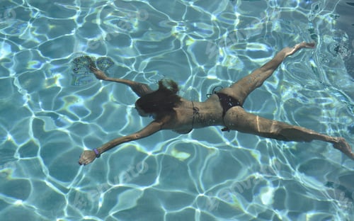 Preview: Woman Relaxing In The Pool