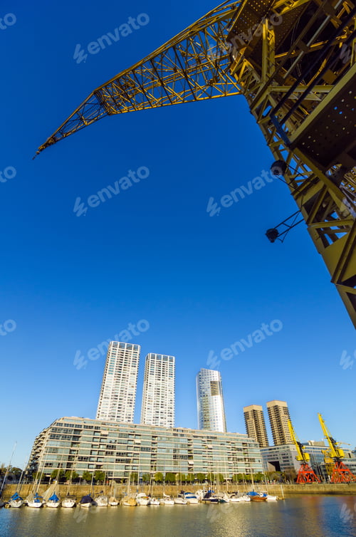 Preview: Waterfront Of Puerto Madero In Buenos Aires, Argentina With A Tall Yellow Crane Rising Above