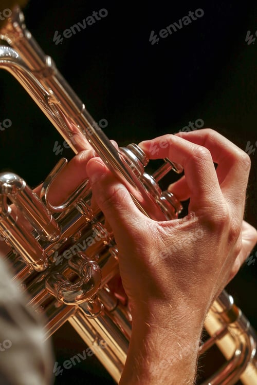 Preview: Close Up Of Hands Playing A Trumpet With Black Background