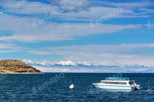 Preview: View Of A Boat On Lake Titicaca With Andes Mountains In The Background As Seen From Isla Del Sol In