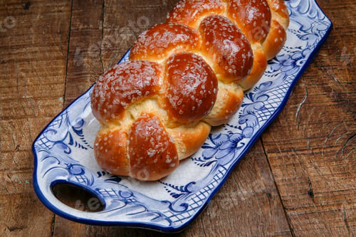 Preview: Sweet Twist Bread, Typical Of Brazilian Bakery, On Dish Decorated In Blue In Rustic Wooden Table