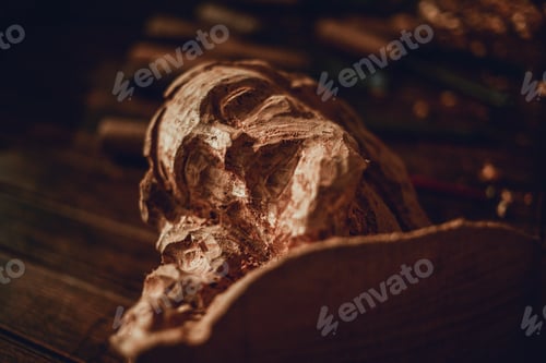 Preview: Face Made Of Wood At A Workshop With A Chisel. Woodworking