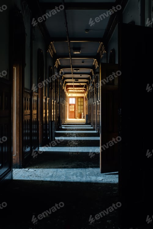 Preview: An Interior View Of A Derelict Hallway With Open Doors At An Abandoned Boys School In New York.
