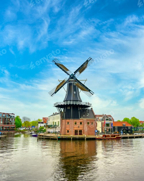 Preview: A Windmill Along The Canals In Haarlem, Netherlands On A Clear Day.