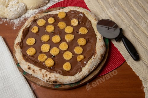 Preview: Chocolate Pizza And Bananas On Wooden Table