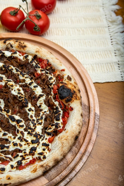 Preview: Shimeji Mushroom And Cream Cheese Pizza And Cooking Ingredients: Tomatoes And Olive Oil On Table