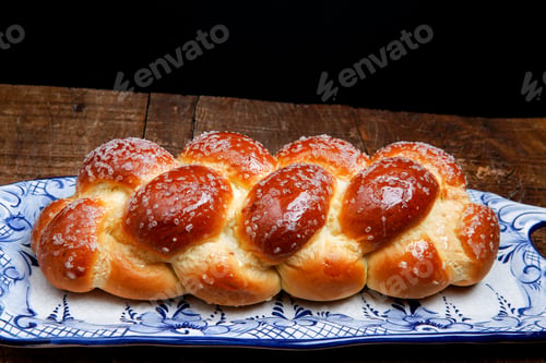 Preview: Sweet Twist Bread, Typical Of Brazilian Bakery, On Dish Decorated In Blue In Rustic Wooden Table