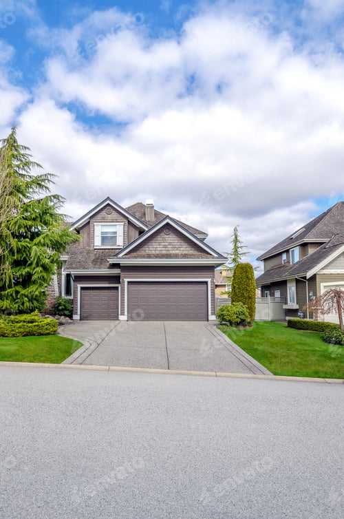 Preview: Luxury House With A Two-Car Garage Against Blue Sky. Exterior Design.