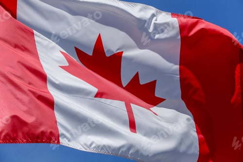 Preview: Flag Of Canada Waving On The Wind With Blue Sky