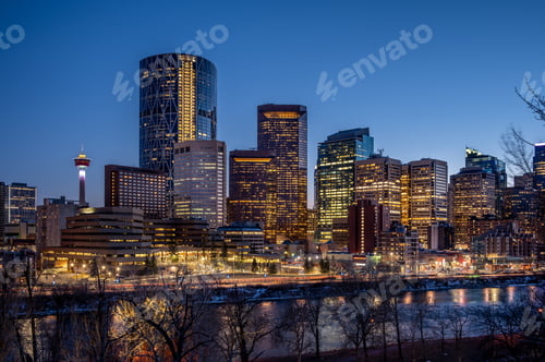 Preview: View Of Calgary'S Skyline Along The Bow River At Dusk.