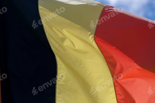 Preview: Belgium Flag , Blowing In The Wind With Blue Sky On Background