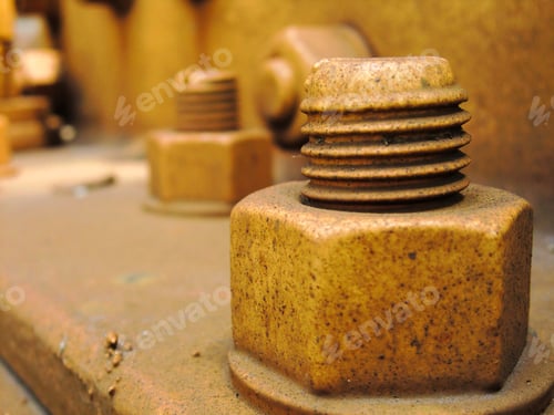 Preview: Industrial Yellow Rusty Nuts And Bolts - Landscape Color Photo