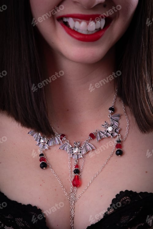 Preview: Young Girl Wearing Black With A Vampire Bat Necklace