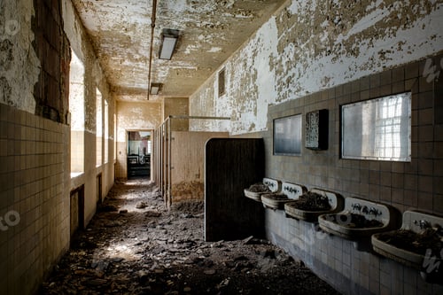 Preview: Mounds Of Hazardous Bird Poop Is Visible In Sinks At A Bathroom Inside A Long Abandoned Hospital.