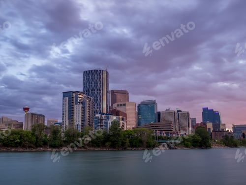 Preview: Calgary'S Skyline With The Bow River In The Foreground At Sunset.