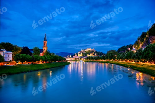 Preview: A View Of Salzburg, Austria Along The Salzach River At Night.