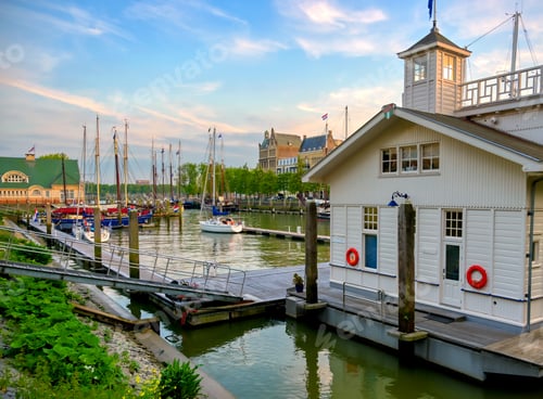 Preview: Ships Docked Along The Canals In Rotterdam, Netherlands At Sunset.