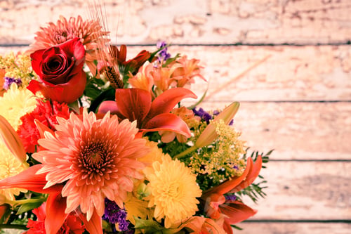 Preview: Floral Bouquet Against Wood Background With Copy Space