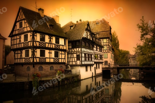 Preview: Strasbourg France With Old Half Timbered Homes And River At Sunset