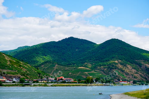 Preview: Green Mountains On Danube Beach. Concept Of Summer Vacations In Austria And Cheap Tours To Europe.