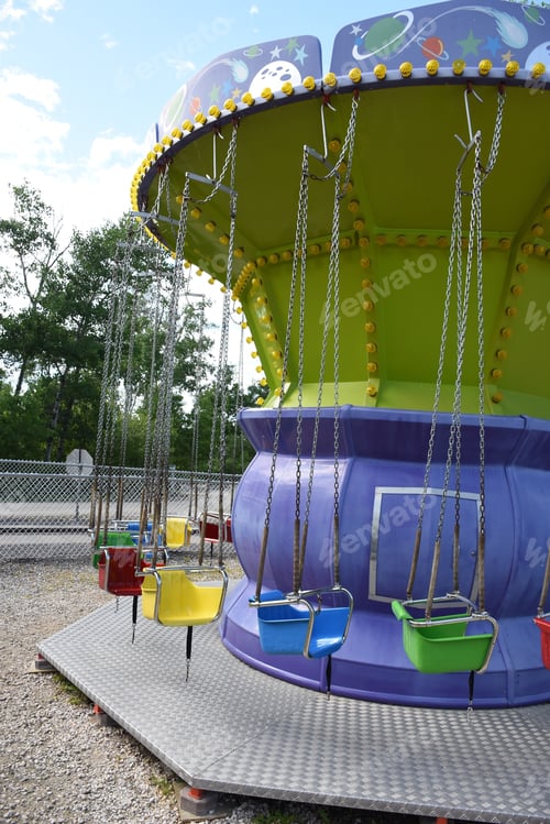 Preview: Childrens Swing In Fair Playground