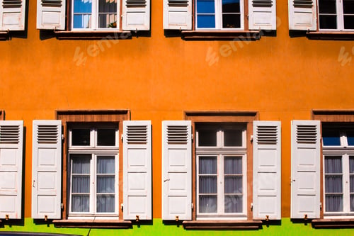 Preview: Colorful Orange Building With White Shutters