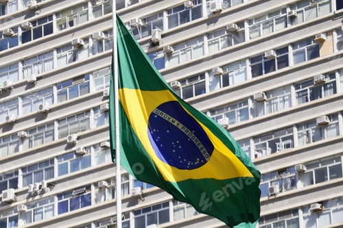 Preview: Brazilian Flag With Building In Background