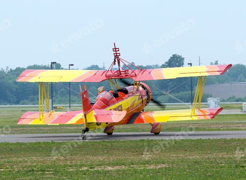 Preview: Color Dslr Picture Of A Red And Yellow Biplane Preparing To Take Off At An Airshow.