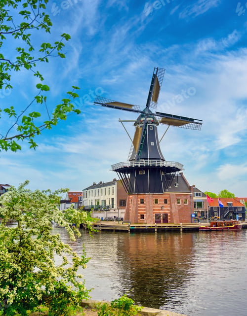 Preview: A Windmill Along The Canals In Haarlem, Netherlands On A Clear Day.