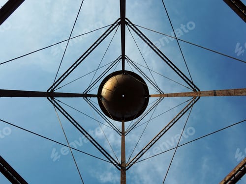 Preview: Industrial Water Tower From Below With Geometric Pattern Reaching Towards Sky
