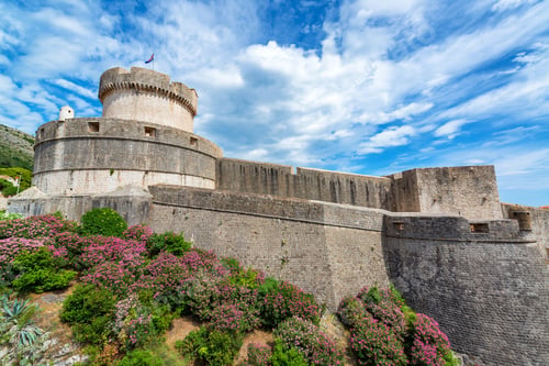 Preview: View Of The City Walls Of Dubrovnik, Croatia With Colorful Flowers