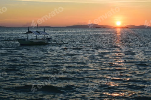 Preview: Sunset Horizon Sea Water Landscape. Sunset In Onuk Island Balabac With Typical Philippins Boat