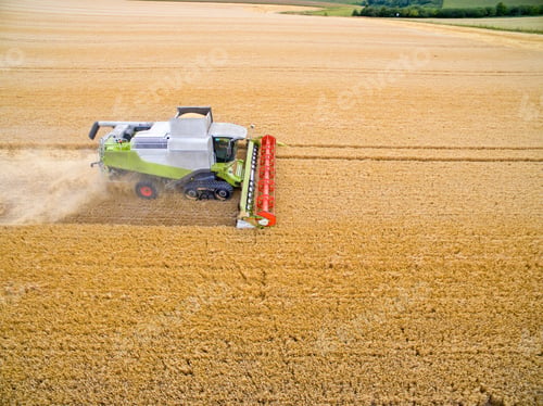 Preview: Aerial View Of Combine Harvester In Golden Barley Field