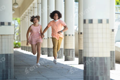 Preview: Happy Young Couple Holding Hands And Running Across The Corridor