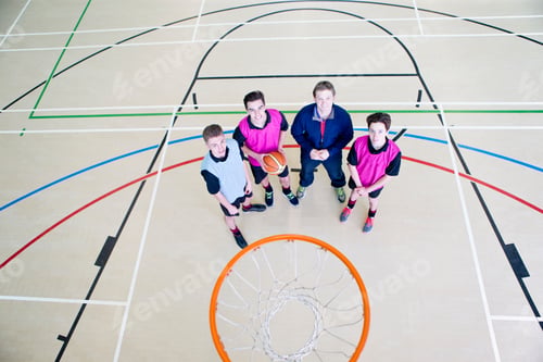 Preview: High-Angle Shot Of A Gym Teacher And His Students Smiling At The Camera While Standing On A