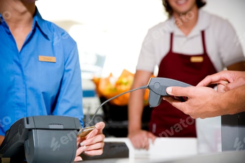 Preview: Close Up View Of A Customer Paying By Credit Card In A Supermarket
