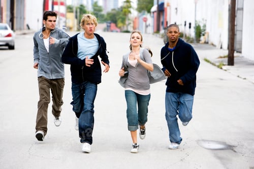 Preview: Group Of Teenagers Running Down An Urban Street