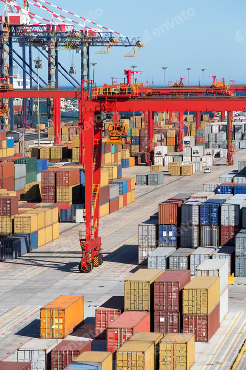 Preview: Vertical Shot Of The Pathway At A Commercial Dock With Cranes And Cargo Containers.