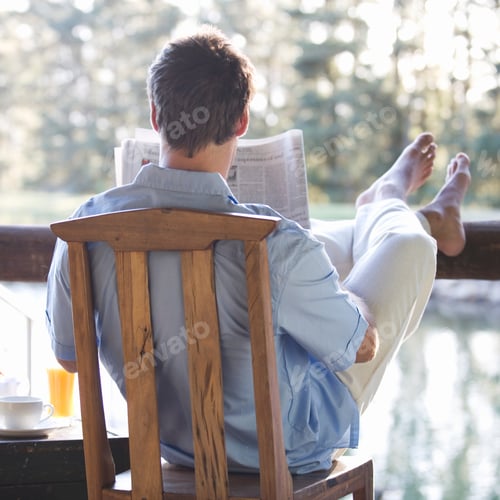 Preview: A Young Man Reading The Paper At Breakfast