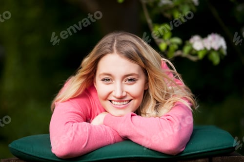 Preview: A Young Woman Laying On A Sun Lounger, Smiling