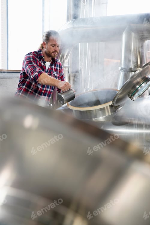 Preview: Man Brewing Beer at a Local Brewery
