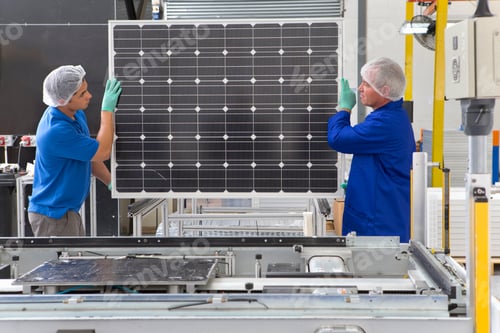 Preview: Factory Workers Lifting New Solar Panel From Production Line