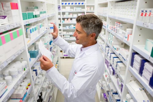 Preview: Pharmacist Searching For Medication On Pharmacy Shelves