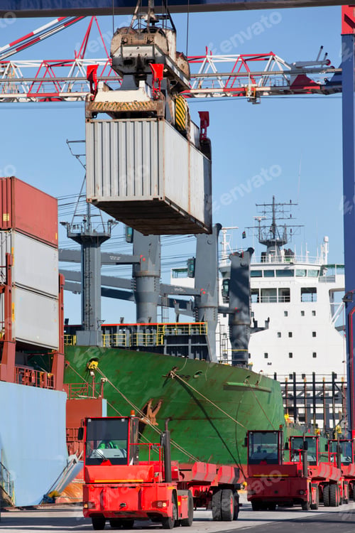Preview: Vertical Shot Of A Crane Loading Cargo Containers On A Truck At A Commercial Dock.