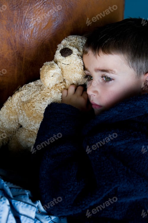 Preview: Little Boy Snuggling Up With Teddy Bear