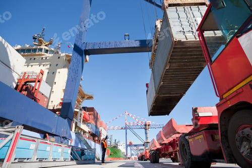 Preview: Worker Directing The Crane Controller To Place The Cargo On A Lorry