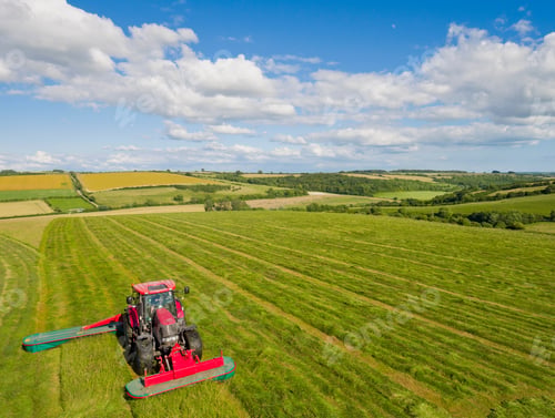 Preview: Aerial View Of Tractor In Field Cutting Grass To Make Silage