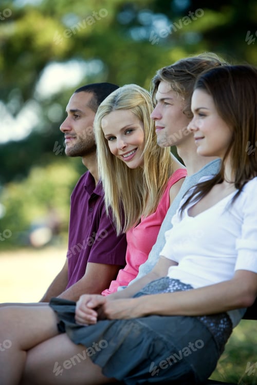 Preview: Four Young People Sitting On A Bench