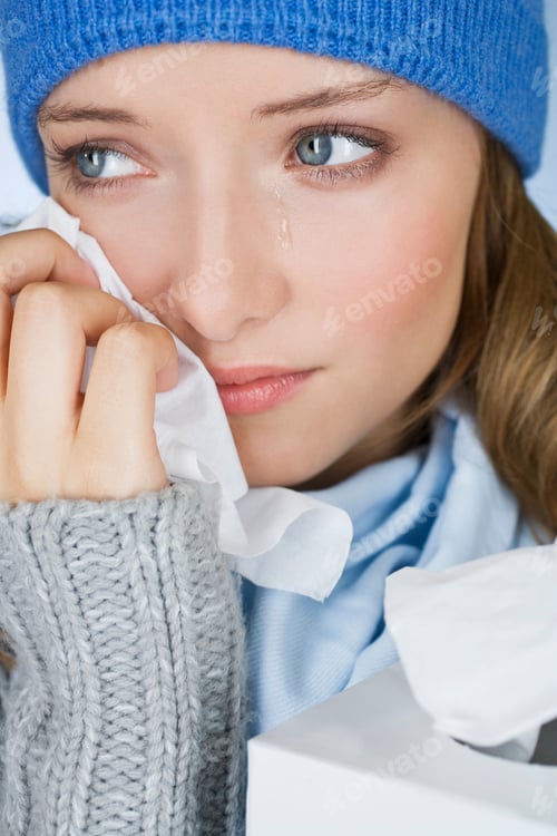 Preview: A Young Woman Crying, Wiping Her Tears Away With A Tissue, Close-Up